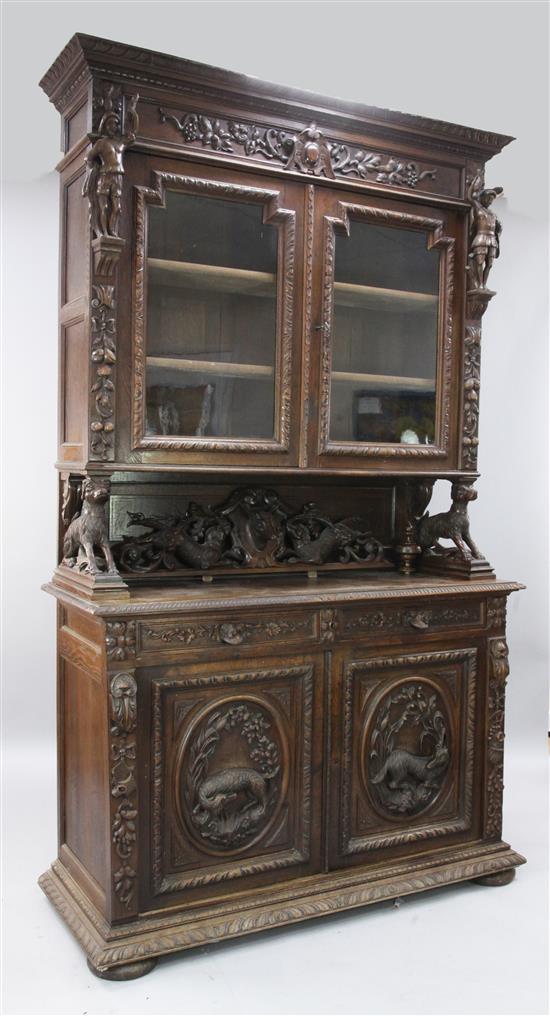 A late 19th century Flemish oak bookcase, W.4ft 8in. D.1ft 10in. H.9ft